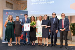 Award ceremony, several people on stage